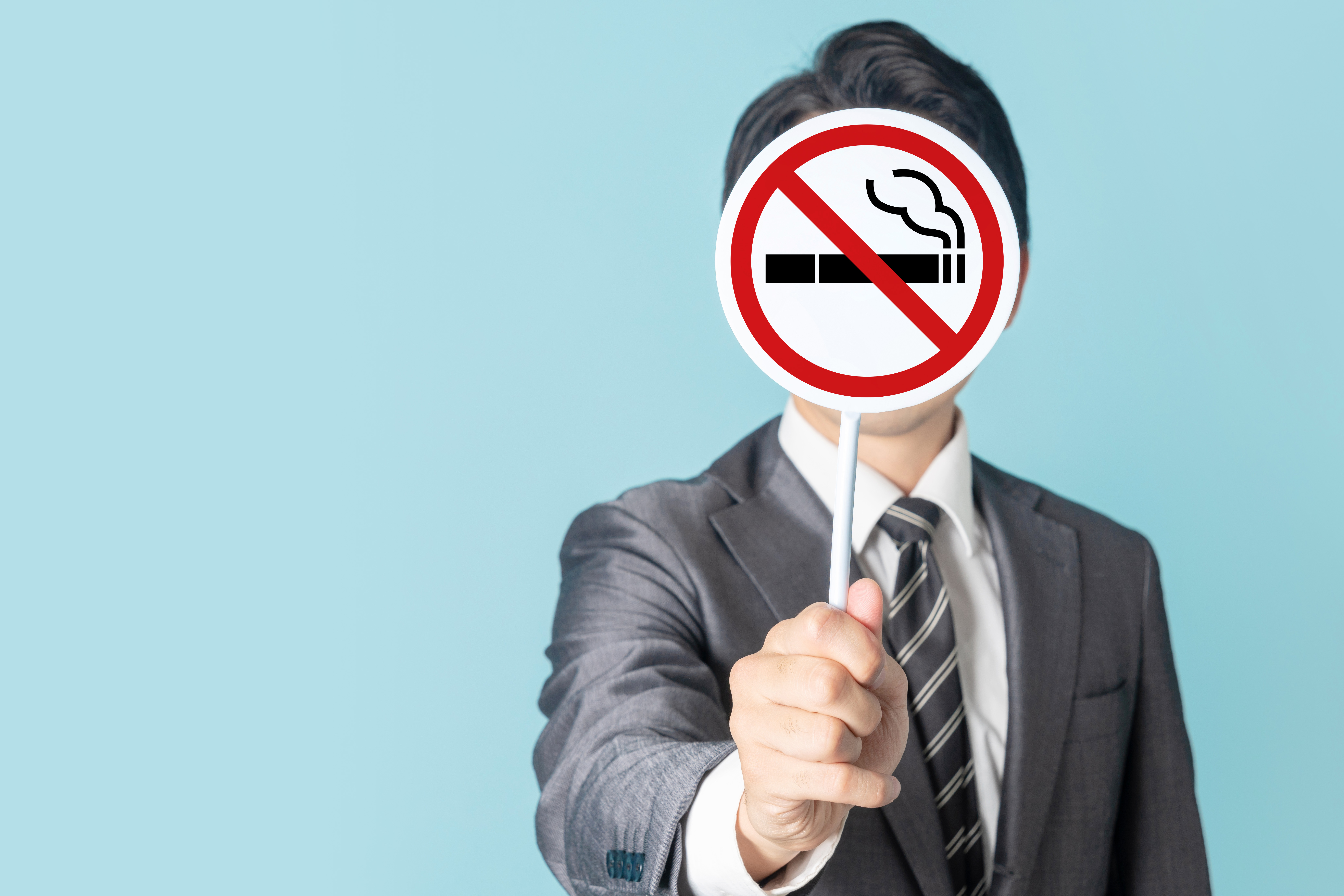 Man showing a No Smoking mark.