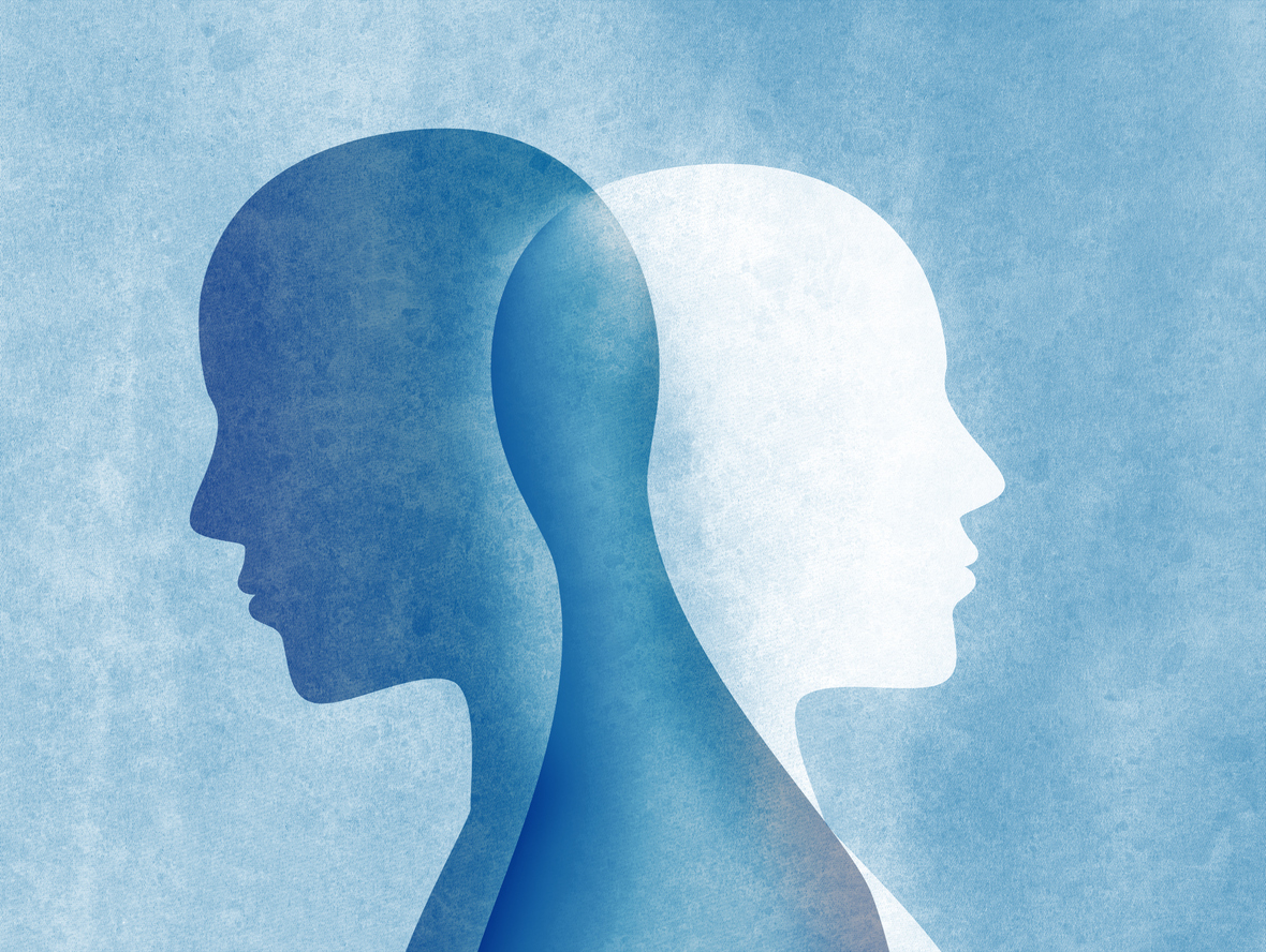 Bipolar disorder concept with two silhouettes of man standing back and intersecting each other on a blue background